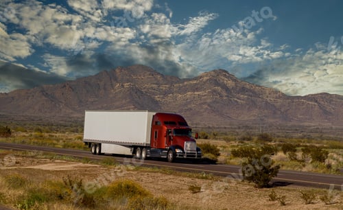 Preview: Classic big rig heavy duty long haul diesel semi truck with refrigerator semi trailer running on th