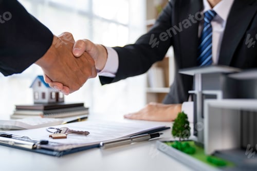 Preview: Real estate agent and customers shaking hands together celebrating finished contract after about hom