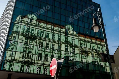 Preview: A historic building is reflected in a modern glass facade, urbanism, abstraction old and new