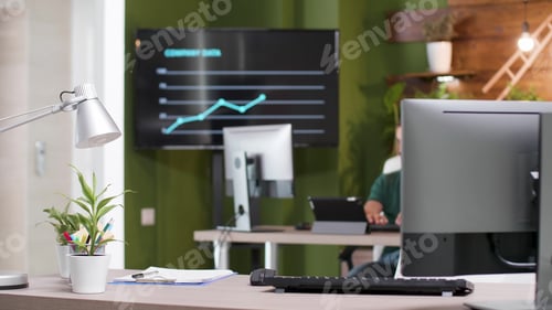 Preview: Entrepreneur man worker sitting at desk table in startup business office typing management strategy