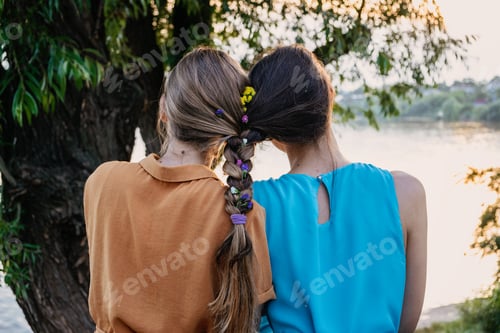 Preview: Women with Braided Hair Decorated with Small Flowers