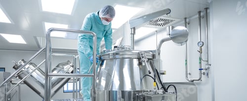 Preview: Pharmaceutical factory man worker in protective clothing operate production line in sterile working