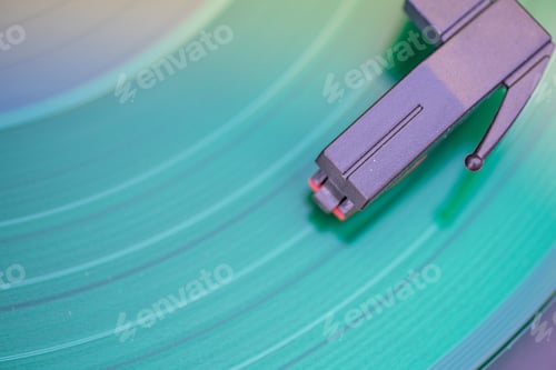 Preview: Close up shot of vinyl record with needle running on tracks shot from directly above