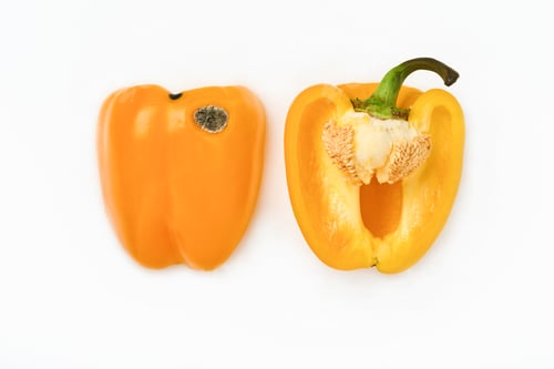 Preview: Moldy and wrinkled rotten yellow peppers cut into two halves. Concept of unhealthy, decompose, spoil
