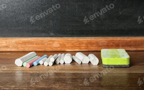 Preview: Chalk and duster on table in classroom