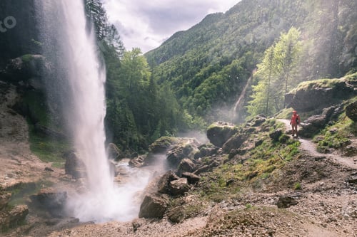 Preview: Tourist at waterfall