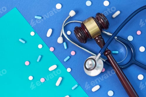 Preview: brown gavel and a medical stethoscope on blue background.