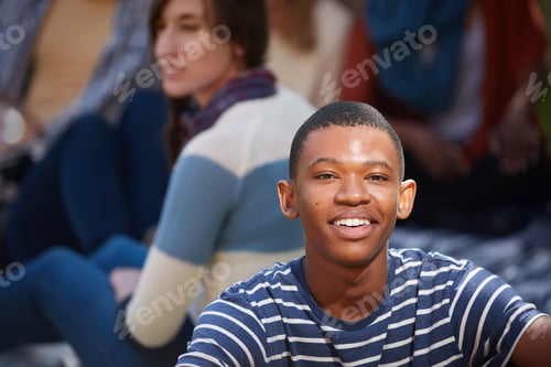Preview: Living that college life. Cropped portrait of a happy young man relaxing outside on campus.