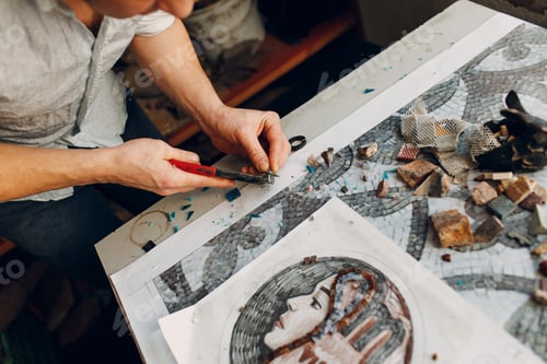 Preview: Craftsman cutting smalt glass with nippers cutters for making smalt glass mosaic.