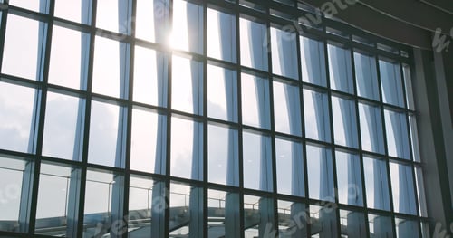 Preview: Airport window with sunlight flare