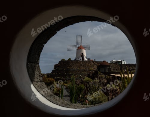 Preview: Scenic view of a windmill on a hill seen from a window in Canary Islands, Spain