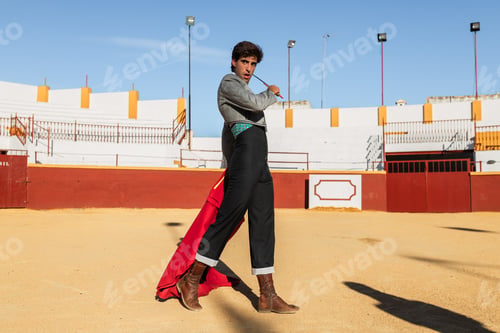 Preview: Male matador performing with red cloth