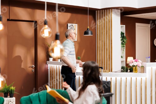 Preview: Elderly travelers wait in hotel lobby
