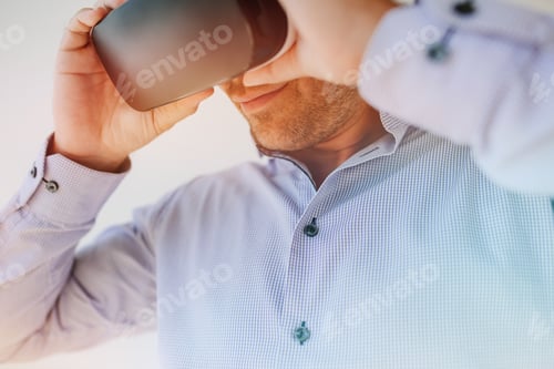 Preview: Businessman using the virtual reality headset