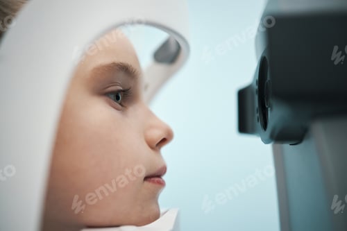 Preview: Child Undergoing Eye Examination with Medical Diagnostic Device