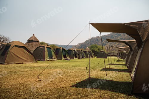 Preview: Tents camping in the african savanna during a cultural trip and safari in tanzania