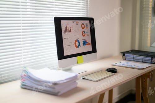 Vista previa: Workspace showing business data analysis on computer screen