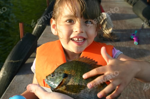 Preview: Happy Little Girl Shows Off the First Fish She Caught