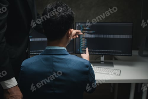 Preview: Group of programmers brainstorm together to write programs on the computer, designing programs to me