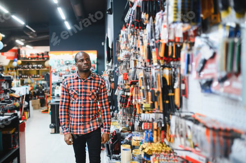 Preview: African american man standing in hardware store