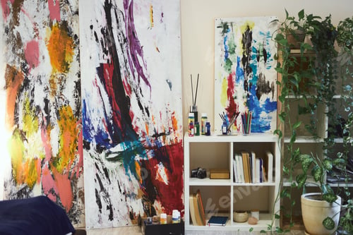 Preview: Abstract art paintings on wall of stylish modern living room interior with bookcase, home plants