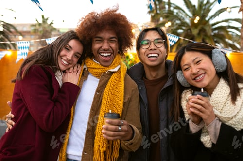 Preview: Happy multiracial college student friends looking at camera smiling on a sunny winter day outdoors