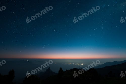 Preview: Beautiful starry night over mountains, water and trees in Kodanad, India