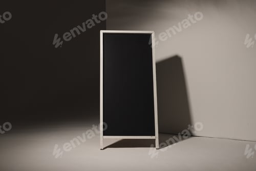 Preview: Black sign in white frame and copy space on grey background