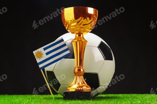 Preview: Golden trophy and Uruguay flag on soccer ball for celebration of a football championship