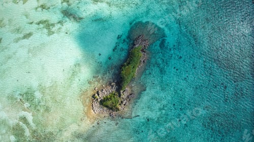 Preview: small island off the coast of a small beach in the ocean