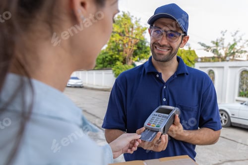 Preview: Delivery express courier young man use giving boxes or Food to woman customer at front home