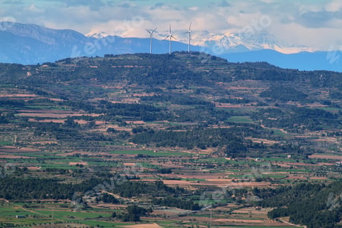 Preview: Distant view of pyrenees and windmills