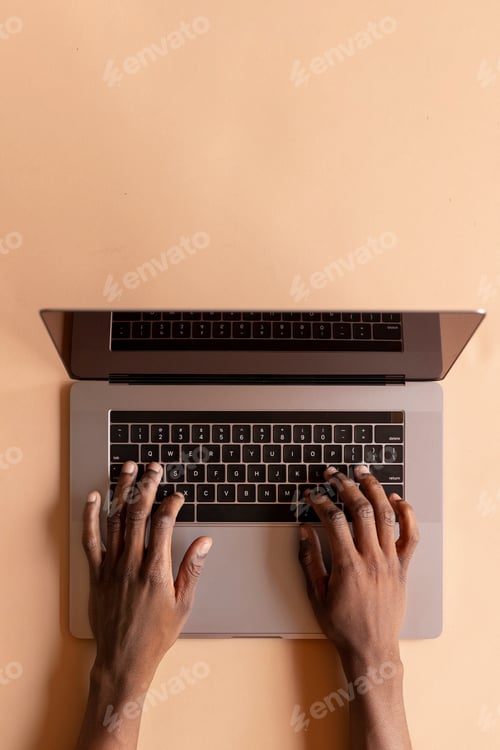Preview: Man using a laptop