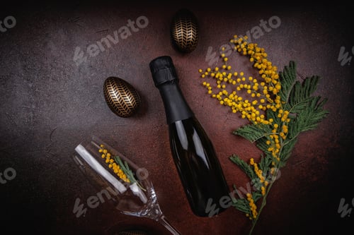 Preview: Festive Easter setup with champagne and mimosa flowers