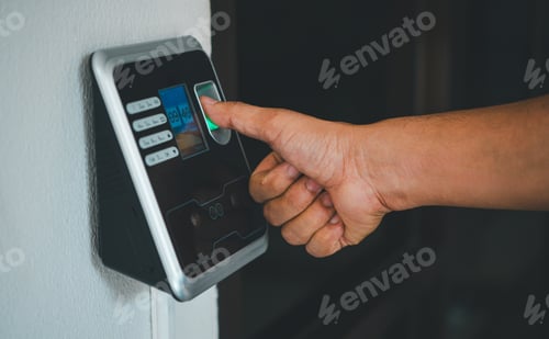 Preview: A person is using a fingerprint reader to access a building