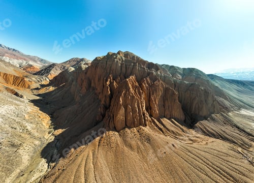 Preview: Wide panoramic of a majestic red rock massif against the blue sky
