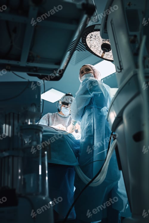 Preview: In the hospital operating room. An international team of professional surgeons and assistants works