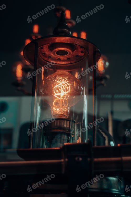 Preview: a small light bulb lit from the top in a dark room