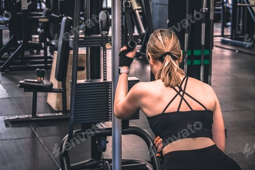 Preview: Gym.Fitness woman working out in the gym, doing exercises for health and beautiful figure.fitness in