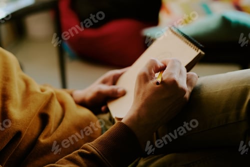 Preview: Hands Of Man Drawing In Sketchbook