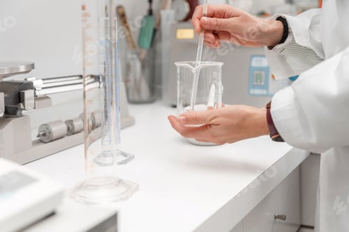 Preview: Close up of Pharmacist or scientist making medicine in laboratory using laboratory equipment