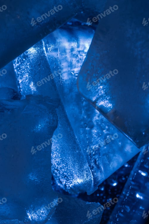 Preview: Closeup shot of ice cubes under blue light