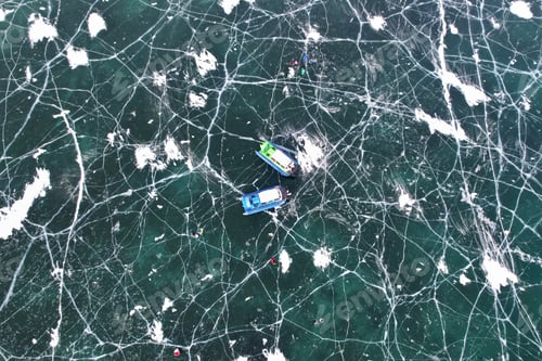 Preview: Ice with cracks, aerial view. Hovercraft on the frozen ice surface
