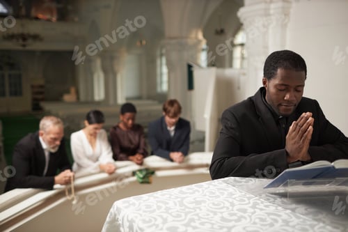 Preview: People Praying in Church