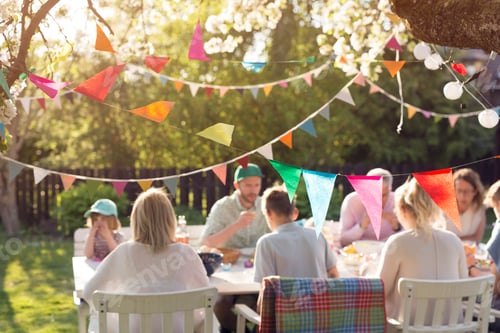Preview: Family and friends enjoying an outdoor meal on a sunny day
