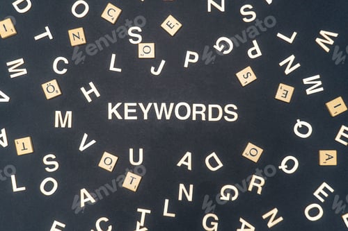 Preview: KEYWORDS word written on dark paper background. KEYWORDS text for your concepts