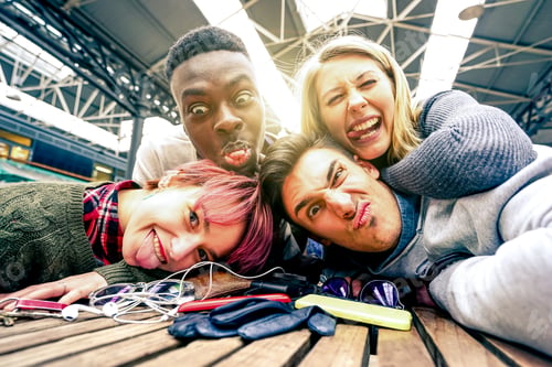 Preview: Best friends taking selfie indoors with back lighting