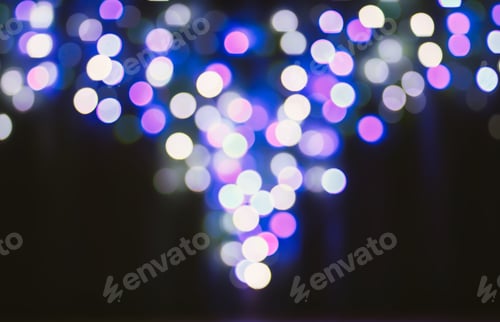 Preview: Abstract bokeh background. Blurred garland lights.