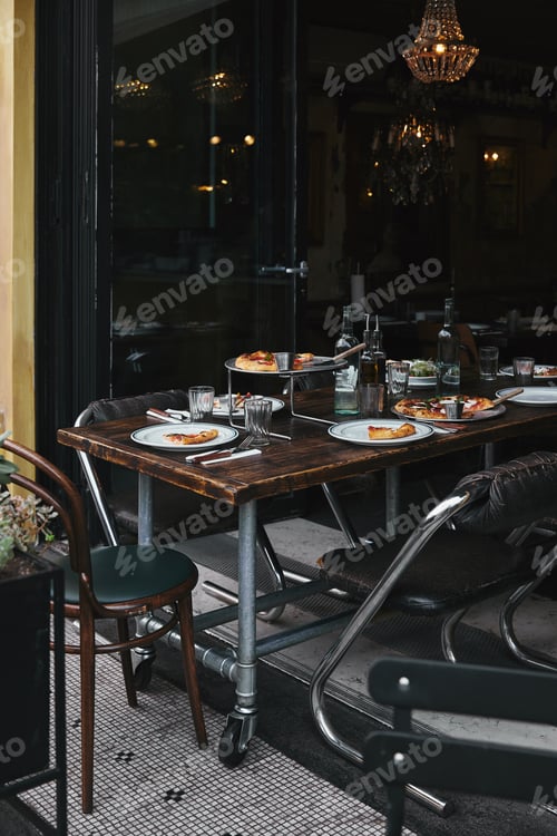 Preview: tasty meal on rustic table at modern restaurant