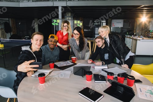 Preview: Start up partners are working in casual clothes, discussing the ideas for new strategy of